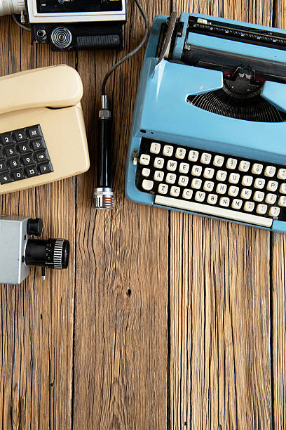 istock Vintage creative workspace with typewriter, camera on wooden background 2256250580