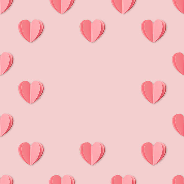 Abstract background made of glowing light trails forming a heart shape in the center with lots of small red hearts.