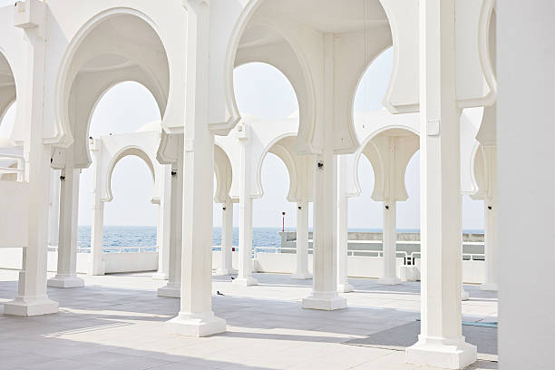 View through sequence of white columns and entablature to Red Sea; structure located on North Corniche in Al-Shate neighborhood.