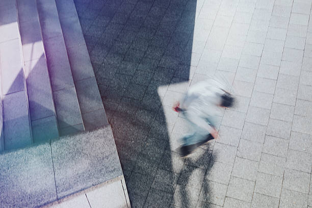 istock motion blurred young skateboarder jumping from stairs outdoors 2256255226
