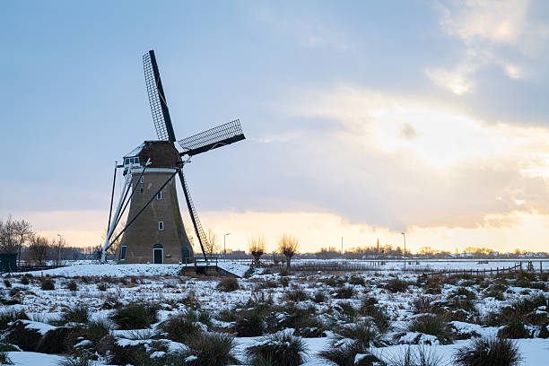 Traditional dutch windmill in a snowy winter landscape, Haastrecht, Netherlands.