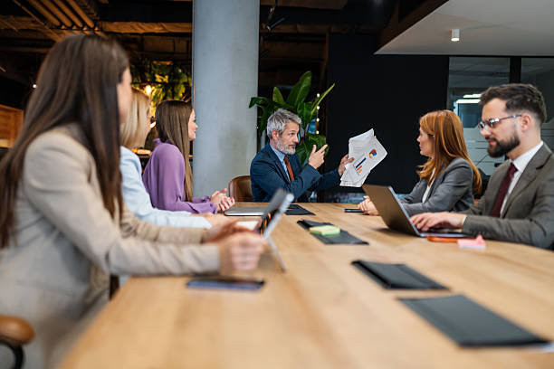 istock Business team discussing financial report during meeting 2256278868