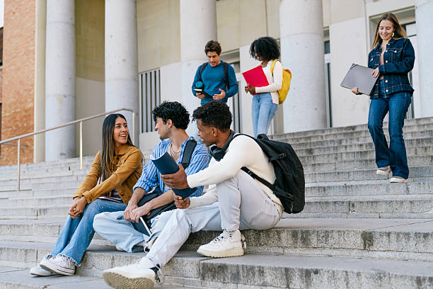 istock Multiracial students group sitting and walking on university stairs 2256279930