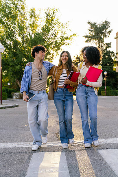 Multiracial students walking together on university campus