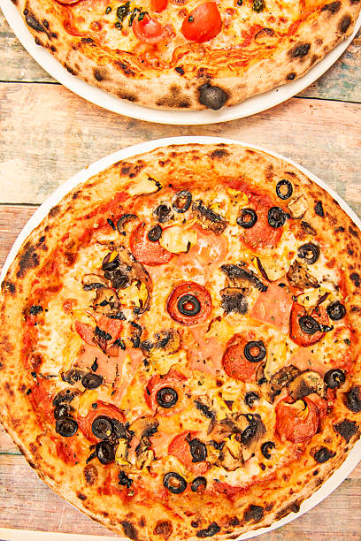 Chicken tikka masala pizza with spiced-marinated chicken, red onion, fresh cilantro, and yogurt sauce