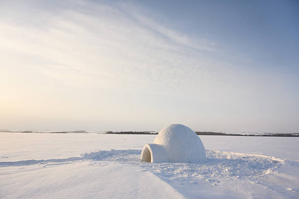 Real snow igloo house in the winter field. Landscape photography