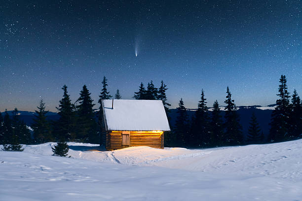 Illuminated house in wintery scene. Very High-resolution stitched image.