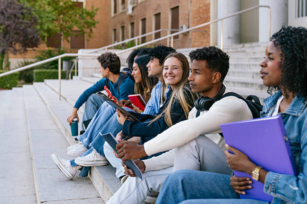 istock Multiracial students sitting on university campus stairs 2256293365