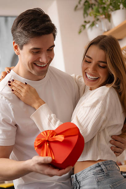 istock Excited Woman Laughing While Receiving Romantic Gift 2256295360