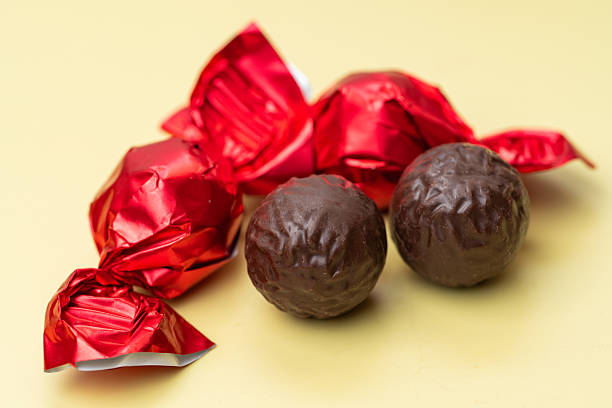 Close-up of chocolate candies in red wrappers