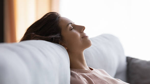 istock Tranquil young pretty woman sleeping on comfortable couch. 2256302442