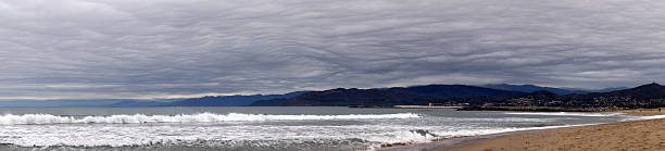 Breaking waves and view from Ventura and Coastal mountain range.