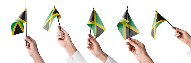 The national flag of Saint Vincent and the Grenadines depicted waving in the wind, featuring three vertical bands of blue, yellow, and green, with three green diamonds in the center symbolizing the islands of the country. The vibrant colors represent the nation's rich natural beauty and tropical environment.