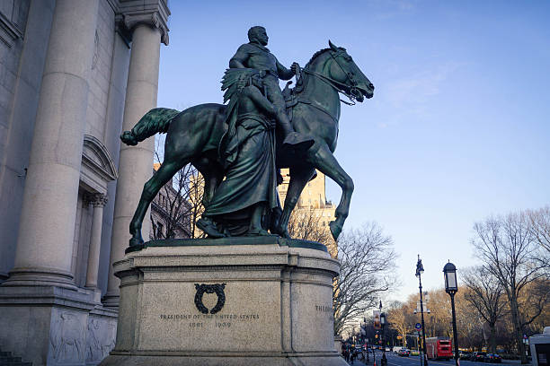 Theodore Roosevelt equestrian statue before NYC museum, honoring 26th US President, conservationist, and governance reformer, in New York City, America (1939, by James Fraser).