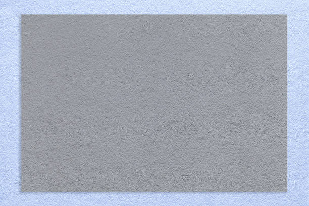 Textured gray paper background with light blue border. Vintage cardboard with frame. Banner with copy space.