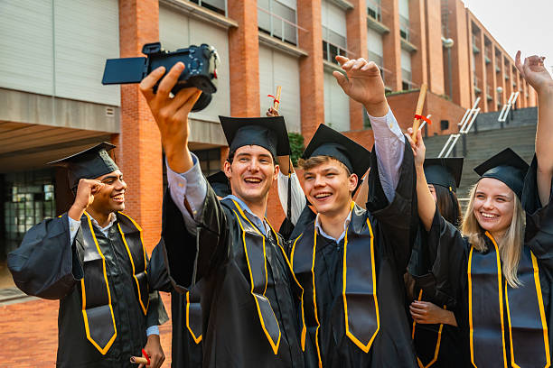 Young adults celebrating their graduation in the campus.