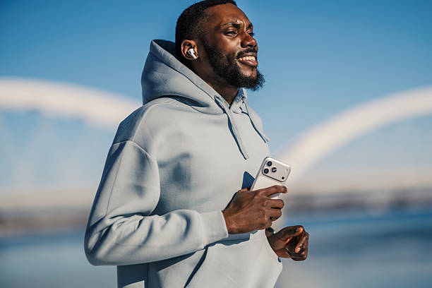 istock Black man jogging enjoying outdoor urban workout 2256379853