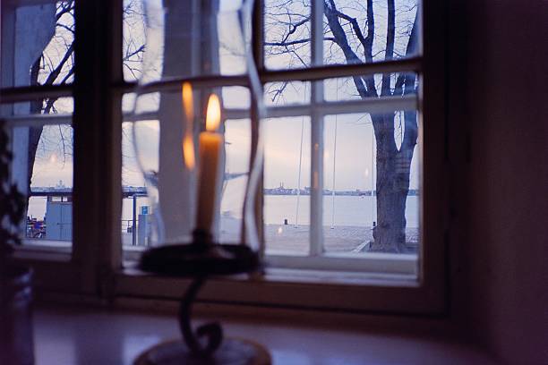 View of Suomenlinna islands from a window with candle in Helsinki, Finland