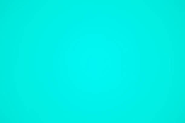 A smooth turquoise surface creates a soothing and vibrant background, perfect for design projects.