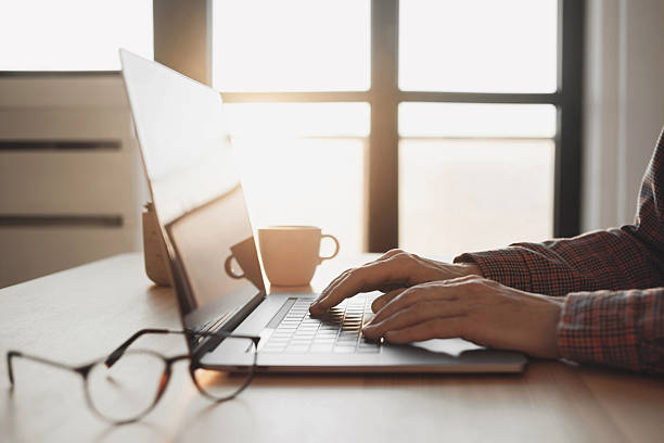 istock Man using laptop at home, businessman working in office. Male hands on laptop keyboard 2256391207