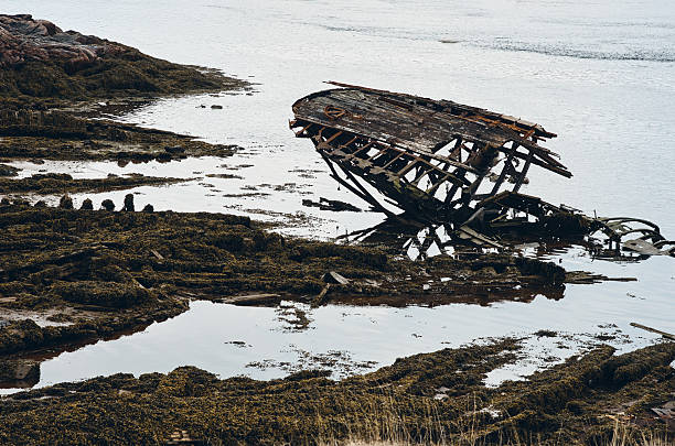 Old wrecked rusty ships near northern shore in Teriberka, Murmansk region