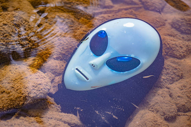 Alien mask on the background of nature