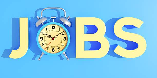 Blue Alarm Clock Jobs Concept This professional 3D illustration displays the word JOBS in bright yellow typography, integrating a classic blue alarm clock as the letter 'O'. The clean blue background emphasizes themes of employment, work schedules, and the timely pursuit of career opportunities. The modern, minimalist style highlights the relationship between labor and time management. This image is an excellent visual aid for recruitment agencies, job listing websites, and corporate presentations regarding hiring or shift work. It visually communicates the concept of time to work, deadlines, and professional punctuality. Perfect for HR managers, career coaches, and businesses looking to illustrate the urgency of the job market. images for job posting stock pictures, royalty-free photos  images