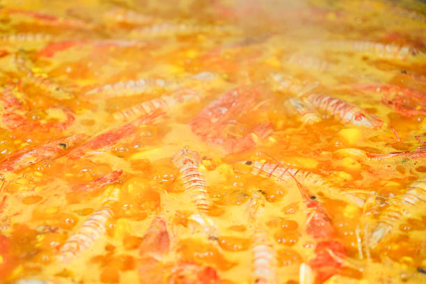 Close up of a spanish seafood paella with prawns and rice traditional dish concept