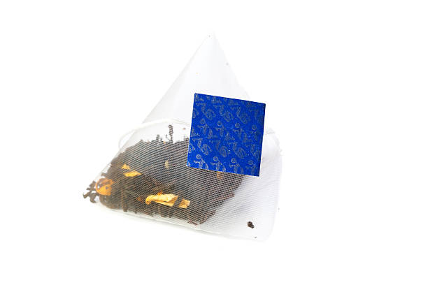 Tea bag on a cloth surface.