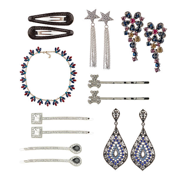 A set of jewelry on a white background. Earrings, hairpins, chains, necklaces.