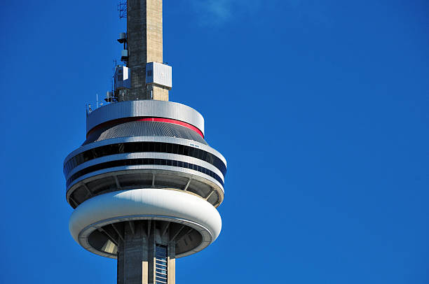 Toronto, Ontario, Canada: the CN Tower, a 553.3-metre (1,815.3 ft) concrete communications and observation tower located downtown. Completed in 1976 by Canadian National Railway, the structure remains the tallest free-standing tower in the Western Hemisphere. The image features the seven-storey main pod. Topped by a 102-metre steel broadcasting antenna, the tower is a signature icon of Canadian engineering and a designated Wonder of the Modern World.