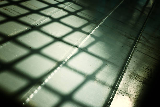 Abstract image of light and shadow created by metal bars