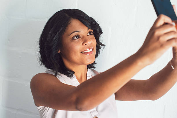 Woman, selfie and smartphone on background. High quality photo
