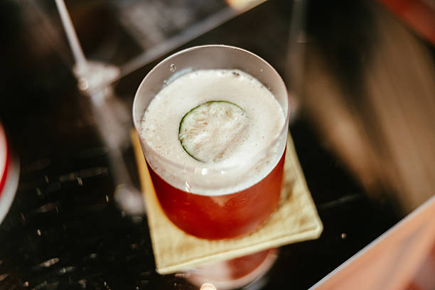 Cold brew fresh coffee is serving with ice and lime zest.