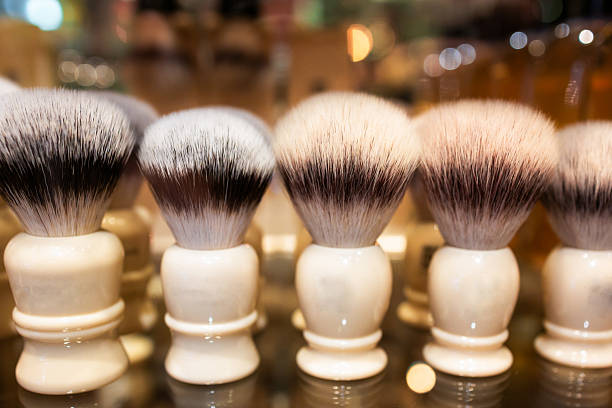 Close up color image depicting a selection of shaving brushes on display and for sale in the men's shaving store.