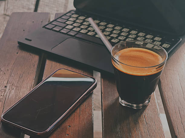 Coffee and Laptop in Warm Morning Light