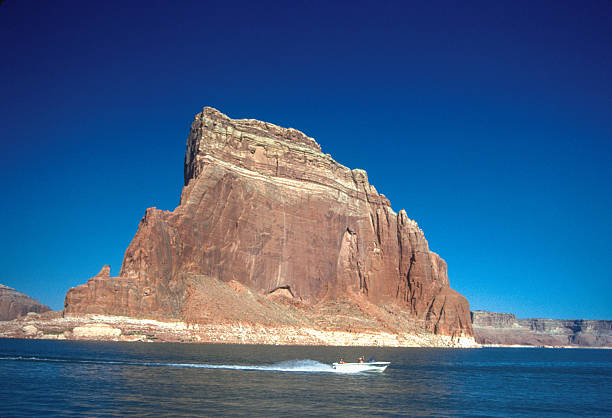 Lake Powell - Speedboat passes a giant butte - 1990. Scanned from Kodachrome 25 slide.