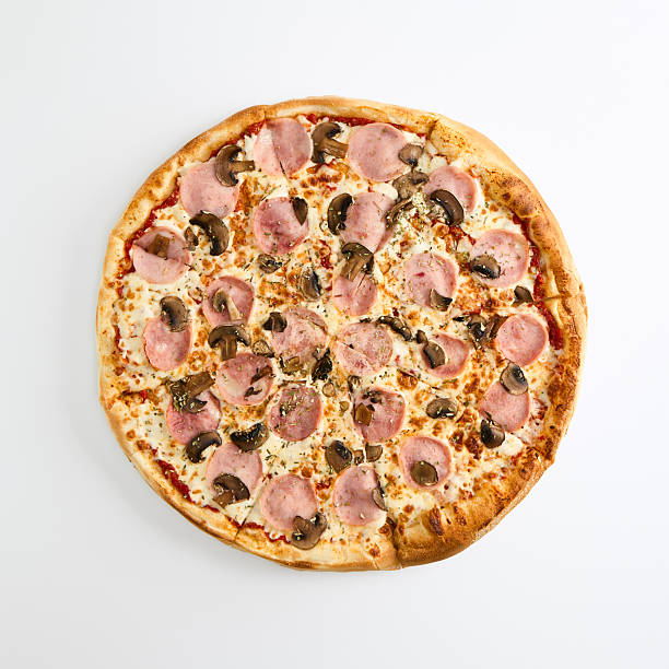Ham and mushroom pizza with mozzarella and tomato sauce on white background, top view for restaurant menu design, delivery promo, and recipe content