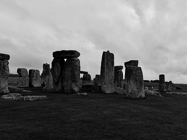 Ancient stone formations rise majestically against a moody sky in Amesbury, England. The rugged landscape invites explorers to ponder the history and significance of these mystical structures. Their eerie beauty contrasts with the dark clouds, creating a unique atmosphere perfect for photography enthusiasts and travelers.