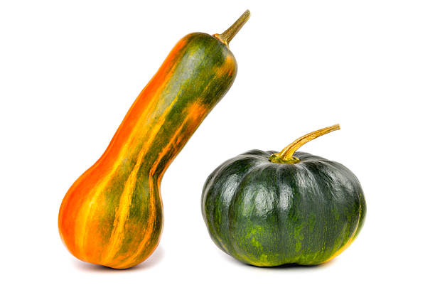 Natural juicy pumpkins on a white background, close-up selective focus