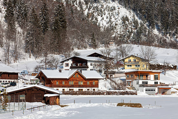 Moountain houses in a beautiful landscape in winter on a sunny day in the Austrian Alps.