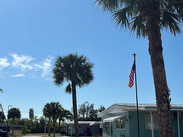 American Flag Flowing in the Tropical Air of Palm Beach, Florida While Surrounded by Palm Trees in the Summer of 2024