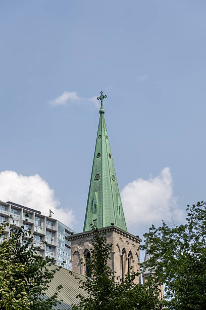 St. Patrick's Basilica spire rising above downtown Montreal, Canada