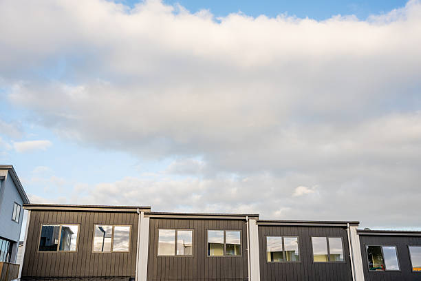 Big sky above the rooftops of a building.