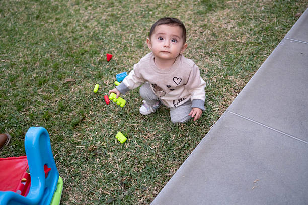 baby playing in the garden