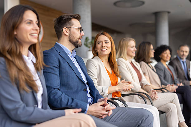 istock Candid Interaction Among Professionals During a Conference 2256511045