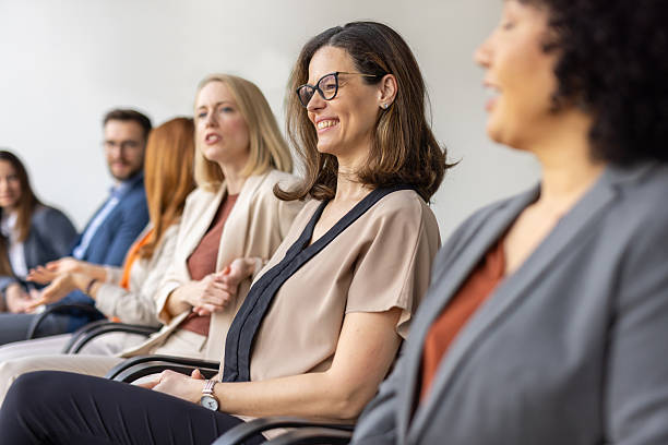 istock Reflective smiles among engaged professionals at meeting. 2256511049