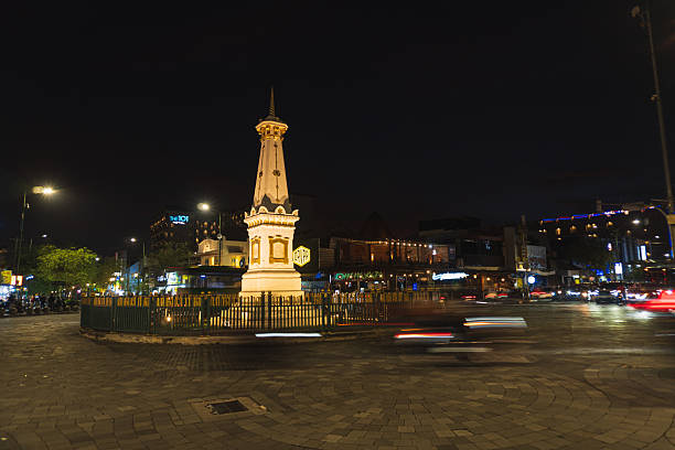 Yogyakarta, Indonesia - Jan 7, 2026: Tugu Jogja at night with light effects. Tugu Jogja or often called Tugu Pal Putih, is the symbol of the city of Yogyakarta.