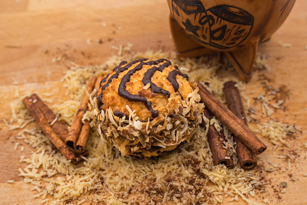 Traditional, Latin American Cocada macaroon like dessert made of shredded coconut, sugar, caramelized condensed milk (dulce de leche) baked into a chewy and golden treat