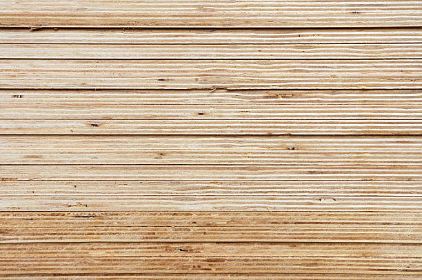 Selective focus on edge of stacked plywood in a retail store. High quality photo